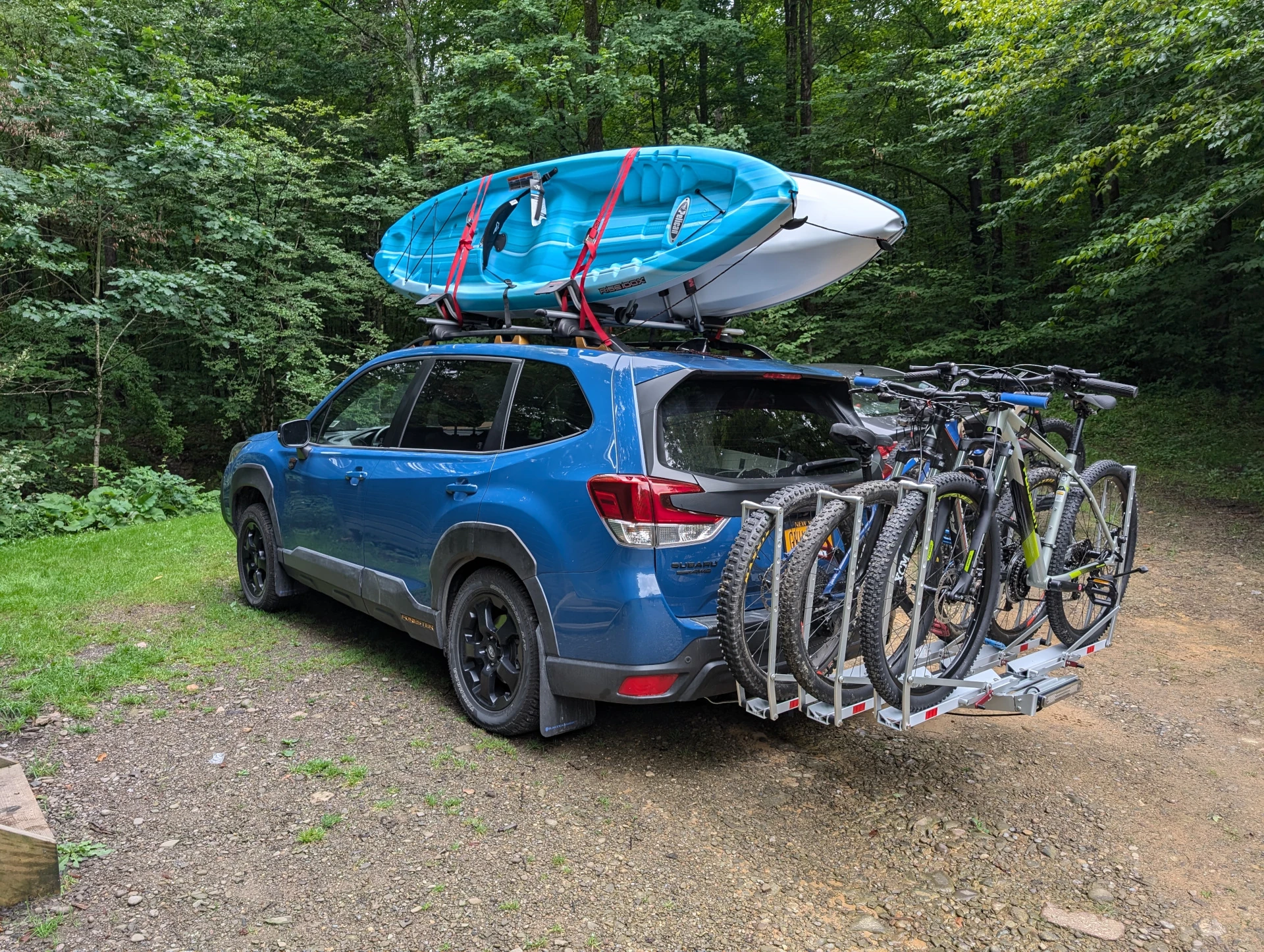 Subaru Wilderness with 3 bikes and 2 kayaks on it