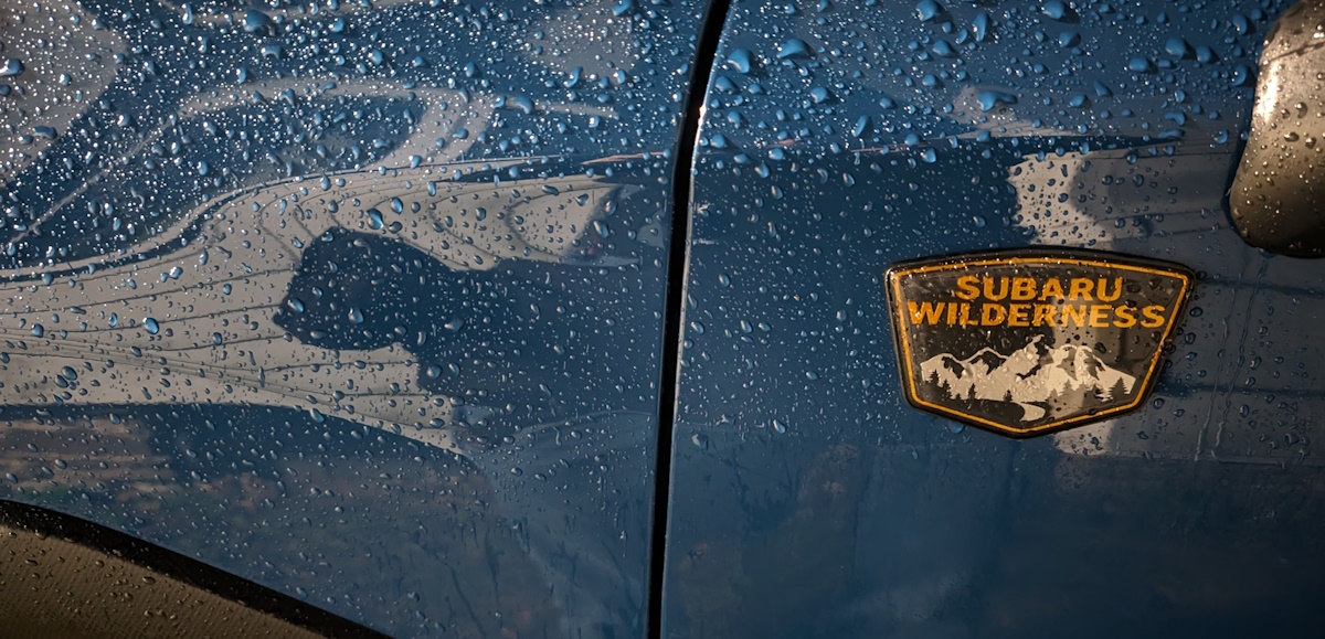 Subaru Wilderness emblem on a Geyser Blue Forester Wilderness